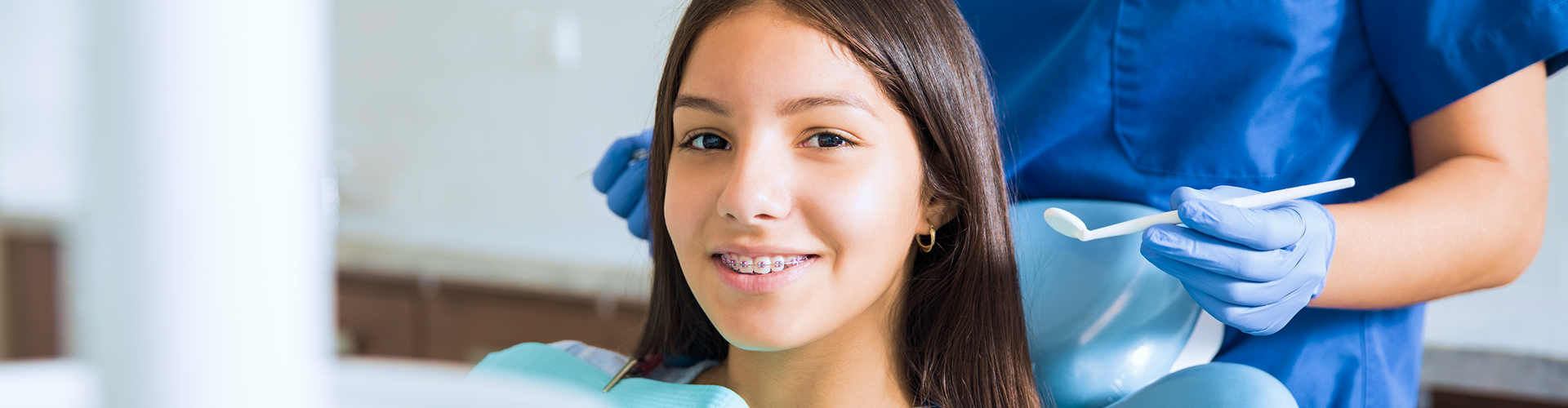 Smiling girl with braces.